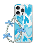 Clear phone case featuring retro layered hearts in shades of blue, attached to a pearl wrist strap with light blue bows.