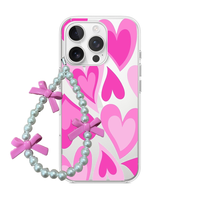Clear phone case featuring retro layered hearts in vibrant pink tones, attached to a pearl wrist strap with pink bows.