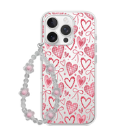Clear phone case featuring pink and red plaid hearts and delicate bows, paired with a soft pink flower bead wrist strap.