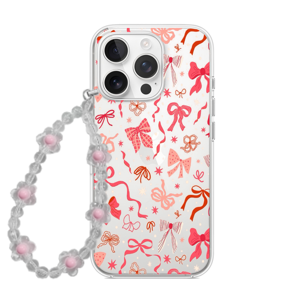 Clear phone case with pink and red scattered ribbon bow pattern and a matching clear beaded flower wrist strap.