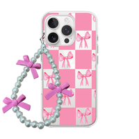 Clear phone case with a pink and white checkerboard background, pink watercolor bows, and a pearl wrist strap with 3D pink bows.