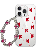 Clear phone case with a pattern of red bows and small red hearts, attached to a clear and red beaded flower wrist strap.