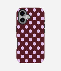 Glossy phone case with a dark burgundy background and large, light purple polka dots.