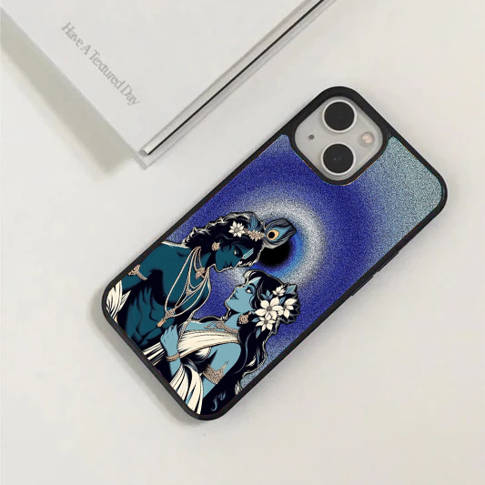Phone case showing modern, stylized profiles of Radha and Krishna looking at each other against a deep blue, glittering starry night sky.