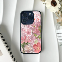 Soft pink phone case featuring a collage of tulips, cherry blossoms, and a central pink flower graphic.
