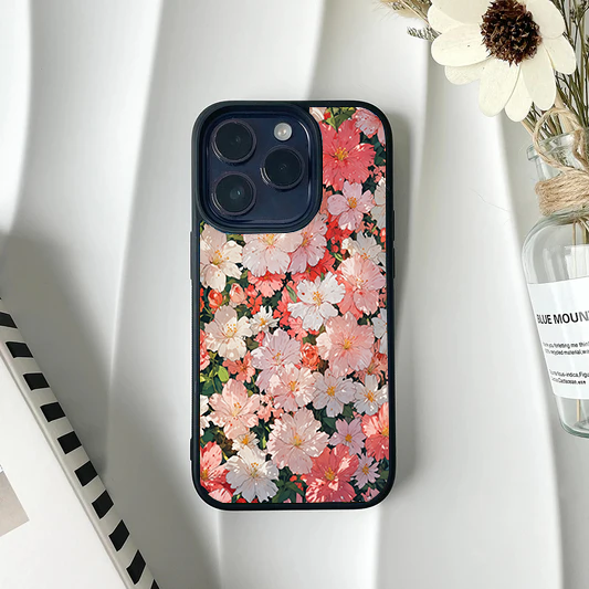 Phone case fully covered in a dense pattern of blooming pink and white cherry blossoms.
