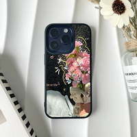 Photo collage phone case showing a hand holding pink carnations with cute doodle accents and text on a dark background.