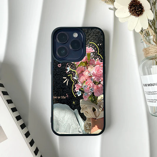 Photo collage phone case showing a hand holding pink carnations with cute doodle accents and text on a dark background.