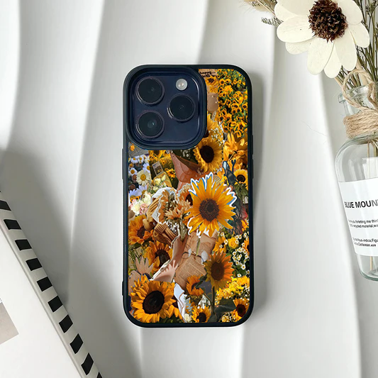 Phone case covered in a dense, vintage scrapbook collage featuring multiple sunflowers and old paper elements.