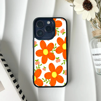 Bright phone case featuring a pattern of large, chunky orange retro flowers and small peach buds on a white background.