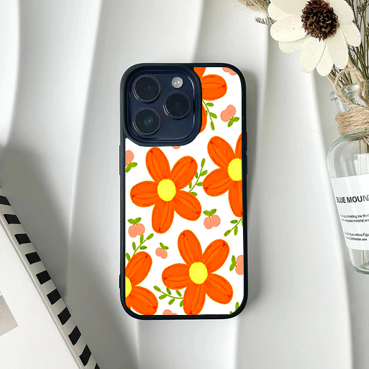 Bright phone case featuring a pattern of large, chunky orange retro flowers and small peach buds on a white background.