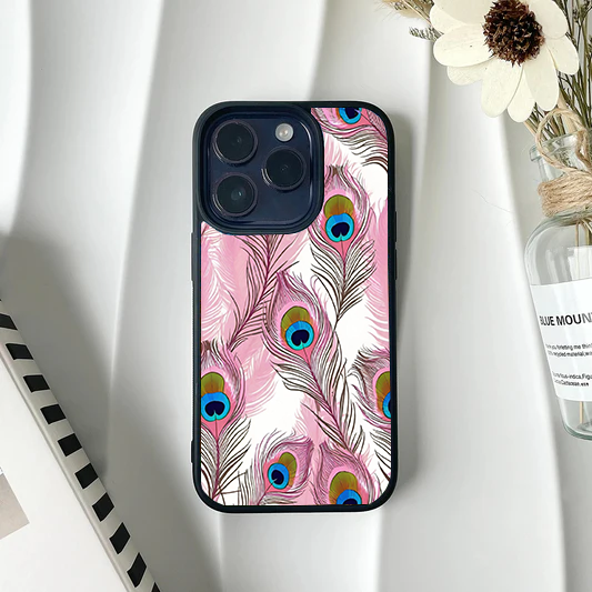 White phone case featuring a repeating pattern of stylized pink peacock feathers with bright blue and green eyes.