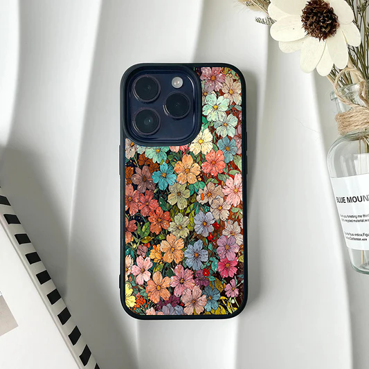 Phone case covered in a dense, dark vintage oil painting style pattern of small, multi-colored flowers.