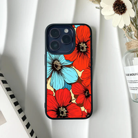 Phone case featuring oversized, graphic pop-art style flowers in bright red and electric blue with heavy black outlines.
