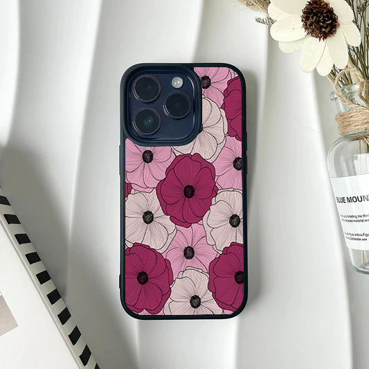 Phone case patterned edge-to-edge with large, overlapping line-art flowers in deep burgundy, pink, and cream.