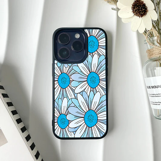 Phone case covered in a dense pattern of oversized graphic daisies with light blue and white petals and bright blue dotted centers.