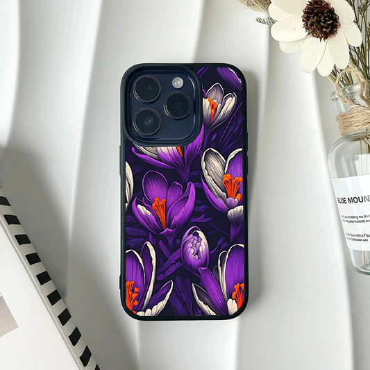 Dark phone case featuring a dense, rich pattern of purple crocus flowers with bright orange centers.