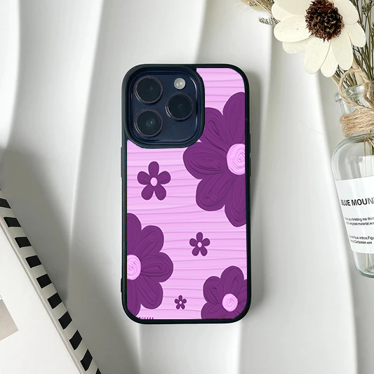 Light pink phone case with a subtle lined texture and bold purple retro flowers.