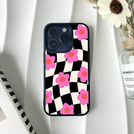 Wavy black and white checkerboard phone case patterned with bright pink retro flowers.
