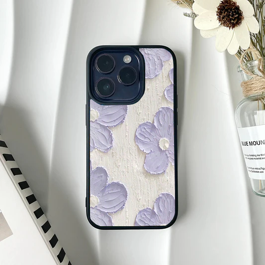 Phone case with a thick, faux-textured impasto design of pastel lavender flowers on a textured cream background.