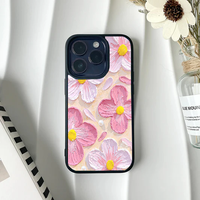 Phone case showing a faux-textured impasto painting of pink and white daisies with falling petals on a pale peach background.