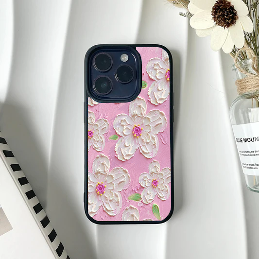 Vibrant pink phone case featuring a faux-textured impasto design of white flowers with bright pink centers.