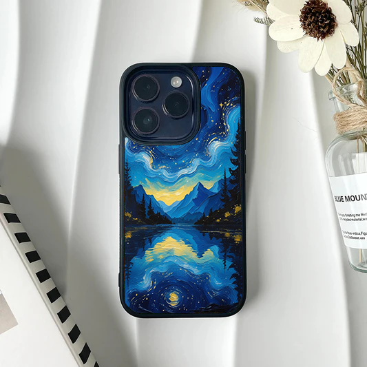 Phone case featuring a Van Gogh style painting of a blue mountain landscape and starry night sky reflected in a calm lake.